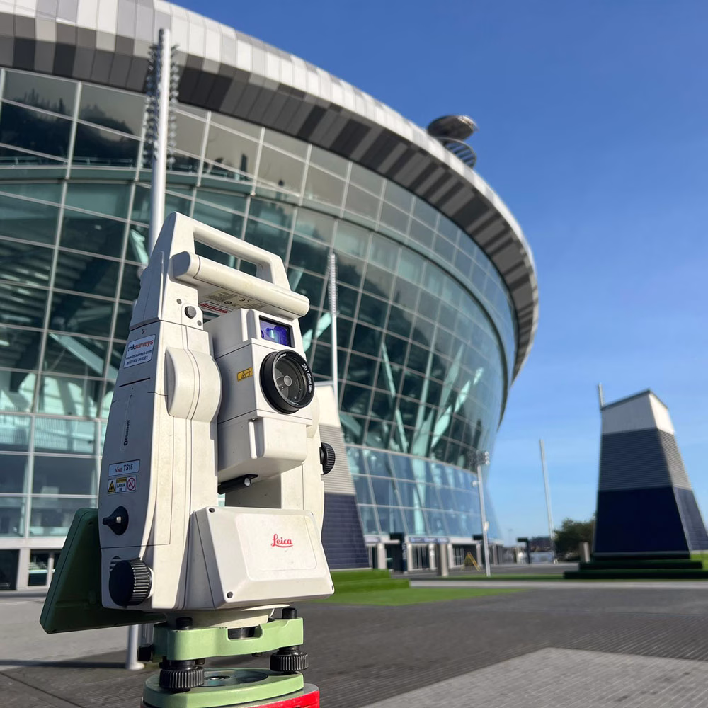 3D Laser scanner outside a large modern glass building